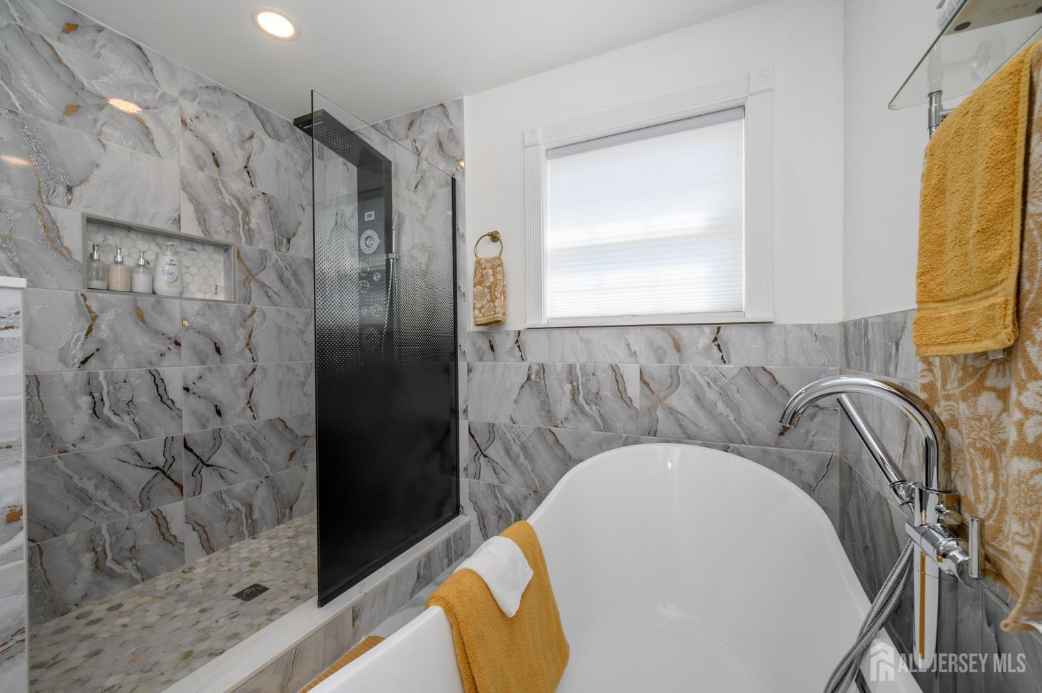 289 Indiana Street Union, NJ 07083 - Photo 34 of 45 a bathroom with a sink and a mirror