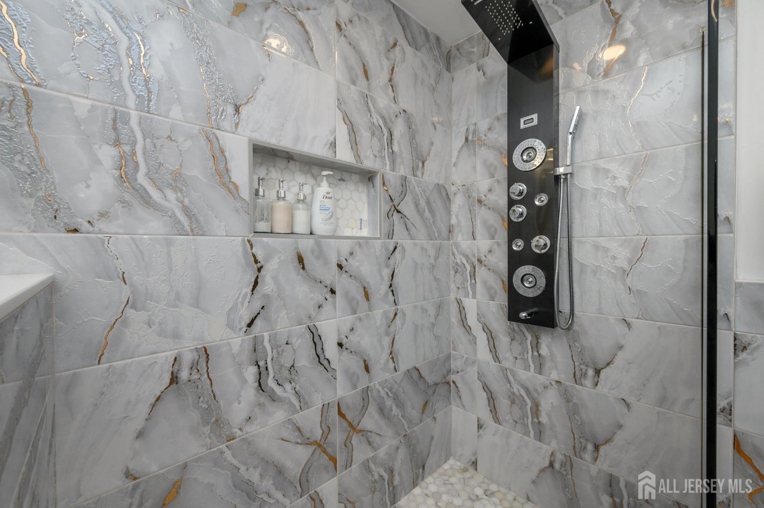 289 Indiana Street Union, NJ 07083 - Photo 35 of 45 a bathroom with a shower and a mirror