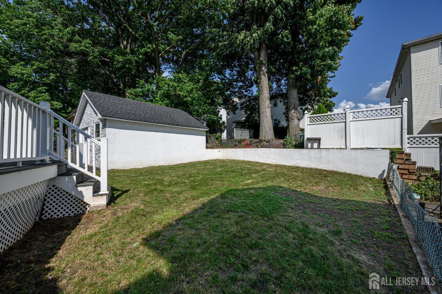 289 Indiana Street Union, NJ 07083 - Photo 43 of 45 a view of an house with backyard and a tree