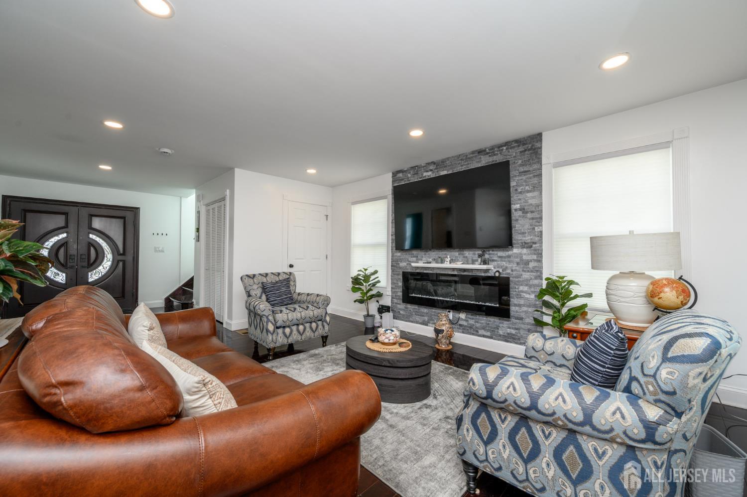 289 Indiana Street Union, NJ 07083 - Photo 9 of 45 a living room with furniture and a flat screen tv