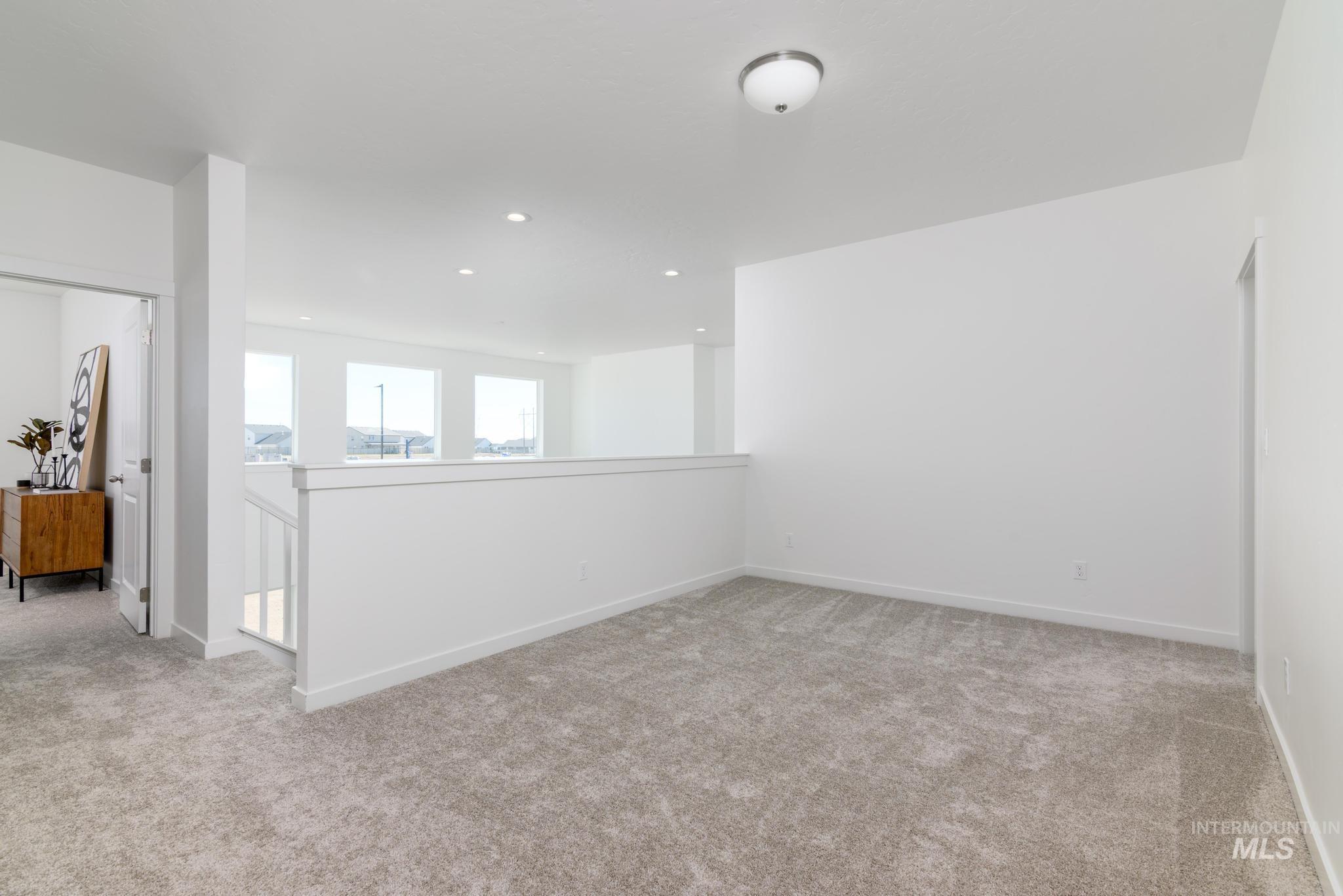 1922 West Declan Street Kuna, ID 83634 - Photo 5 of 9 Spare room with light colored carpet and recessed lighting