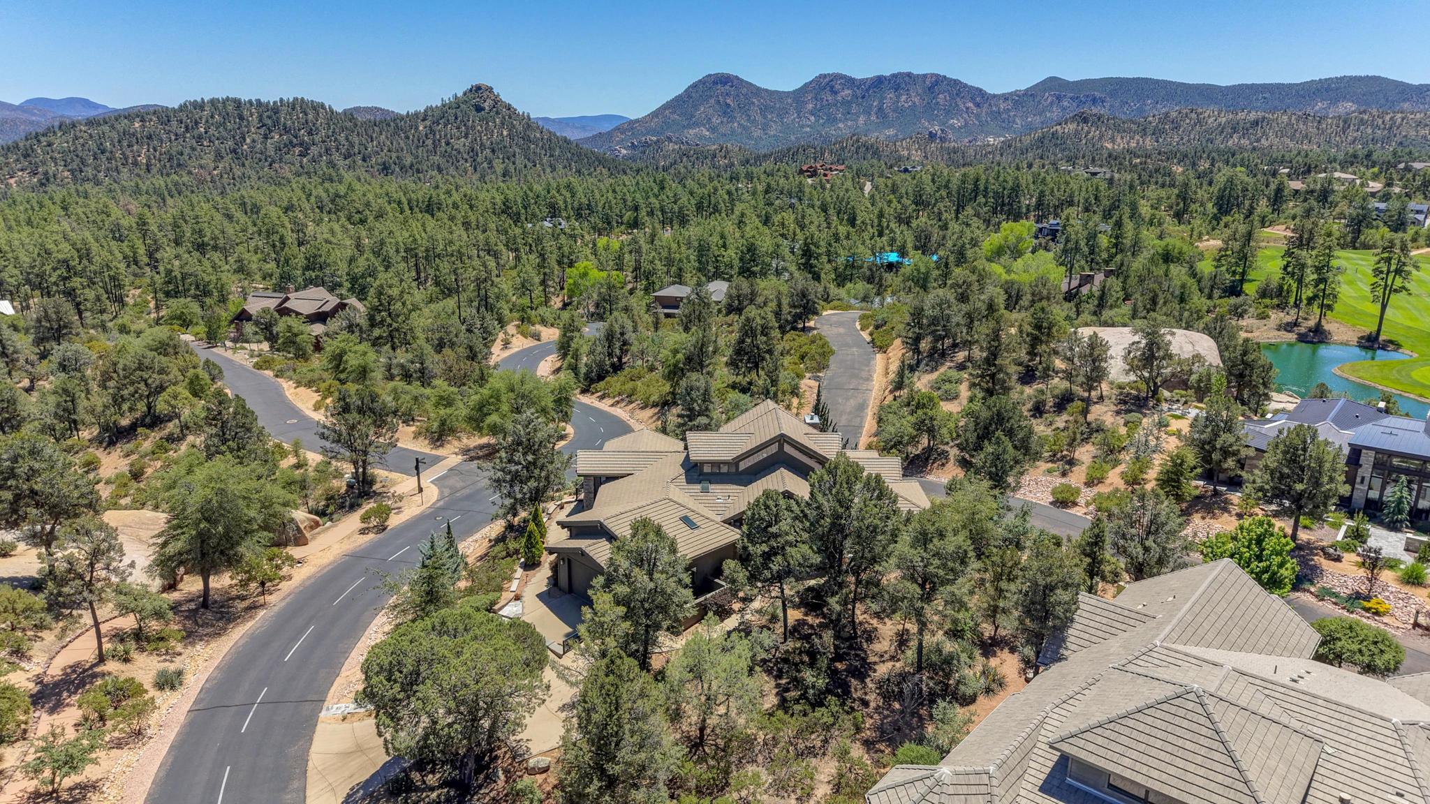 2908 East Rim Club Drive Payson, AZ 85541 - Photo 73 of 77 a view of a house with a mountain in the background
