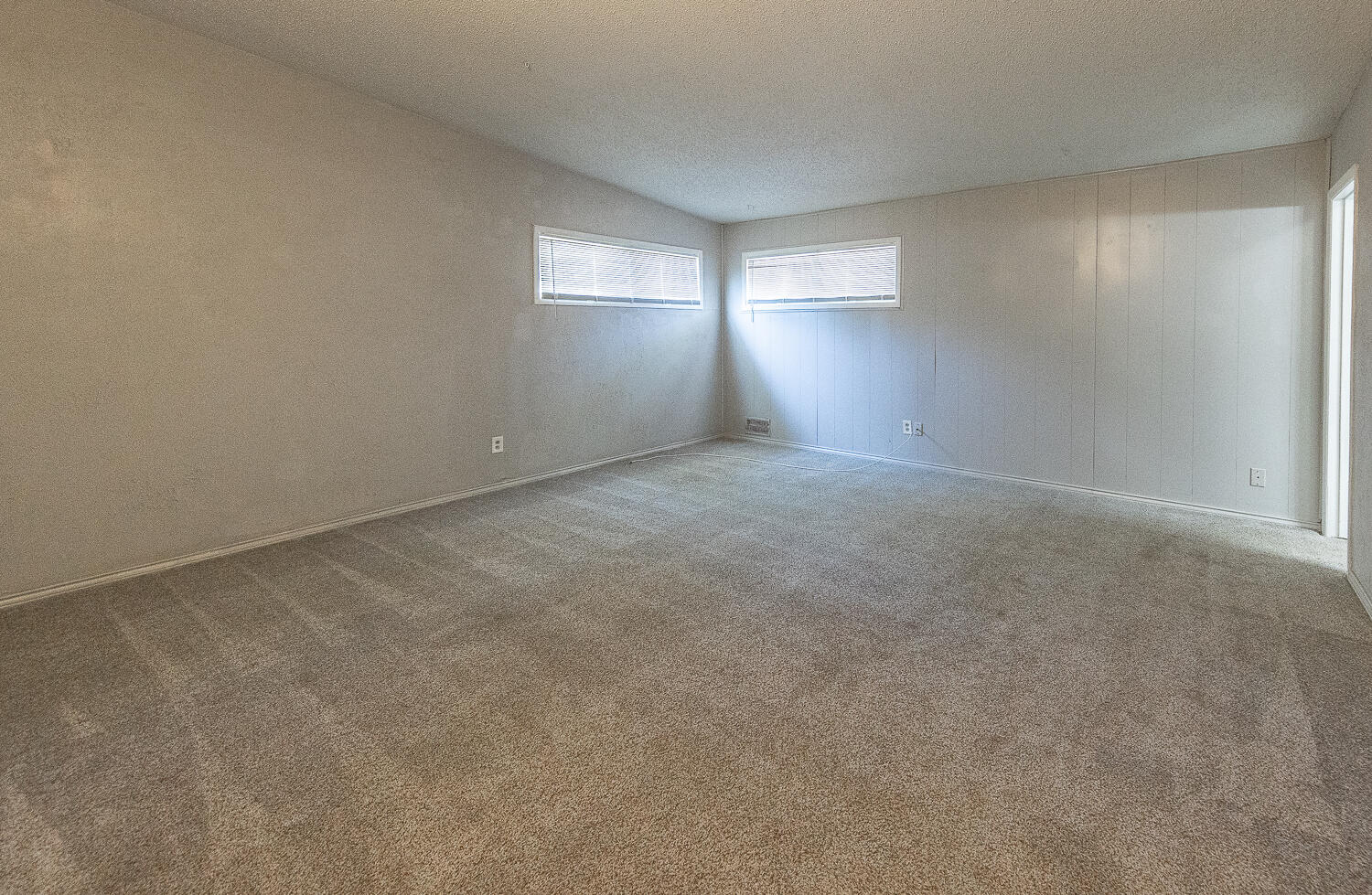 4409 44th Street Lubbock, TX 79414 - Photo 16 of 26 an empty room with windows and closet