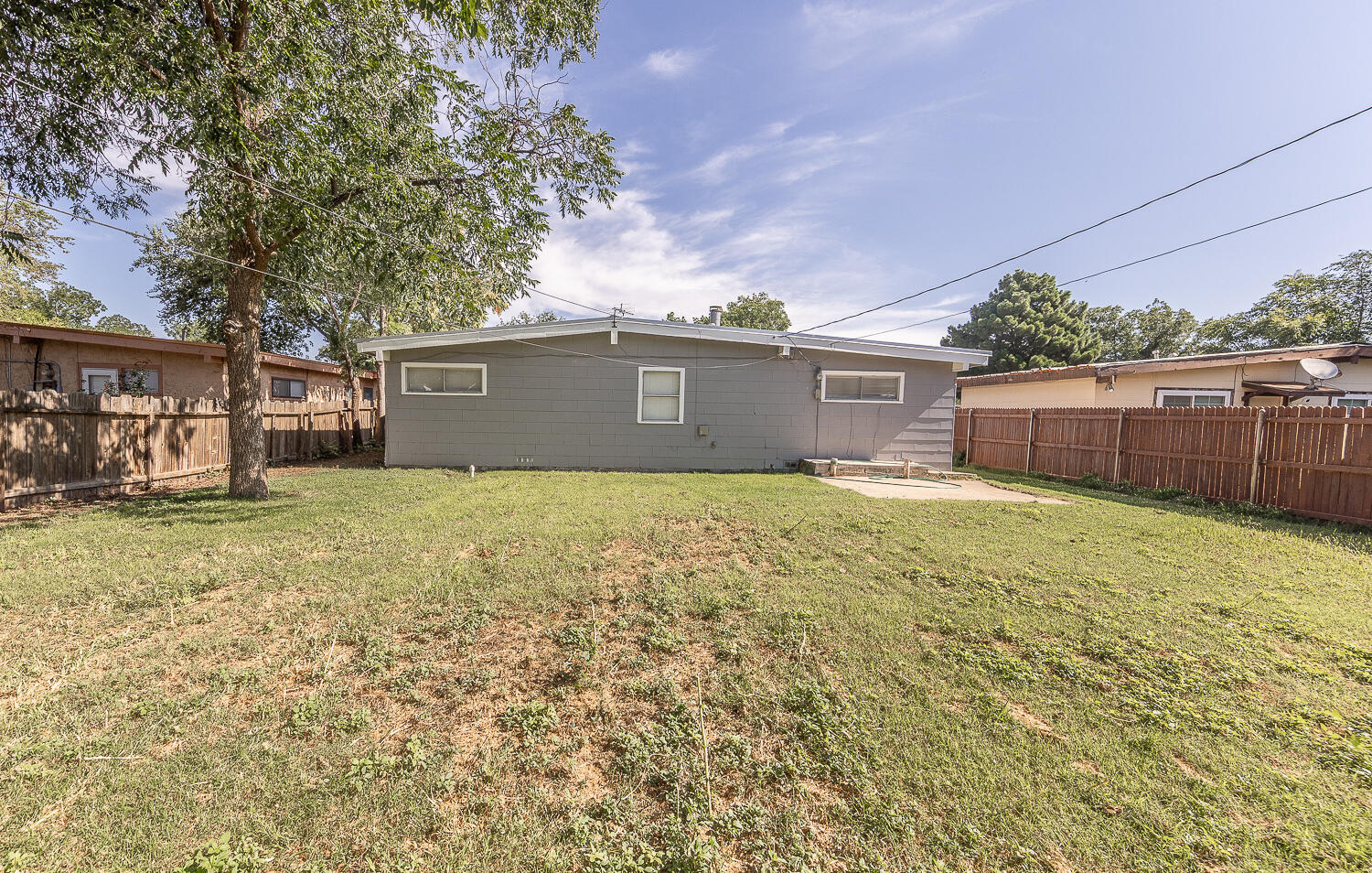 4409 44th Street Lubbock, TX 79414 - Photo 21 of 26 a front view of house with yard and trees