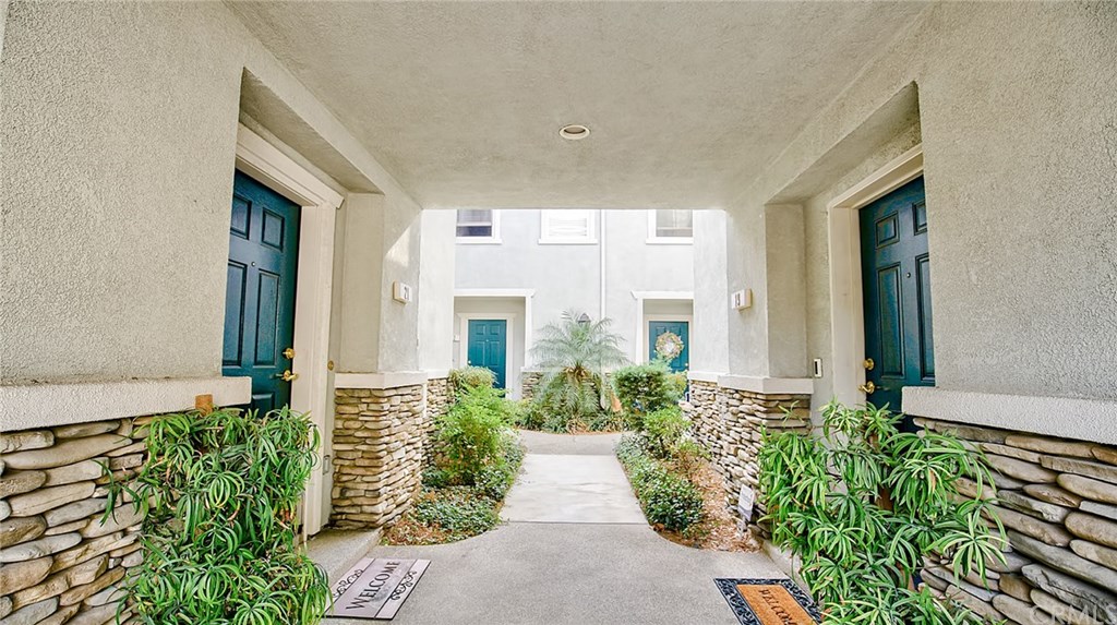 7331 Shelby Place, Unit 23 Rancho Cucamonga, CA 91739 - Photo 2 of 48 a view of a house with potted plants