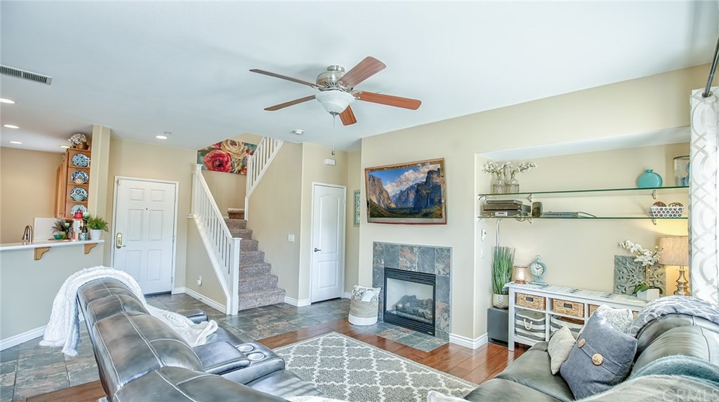 7331 Shelby Place, Unit 23 Rancho Cucamonga, CA 91739 - Photo 11 of 48 a living room with furniture and a fireplace