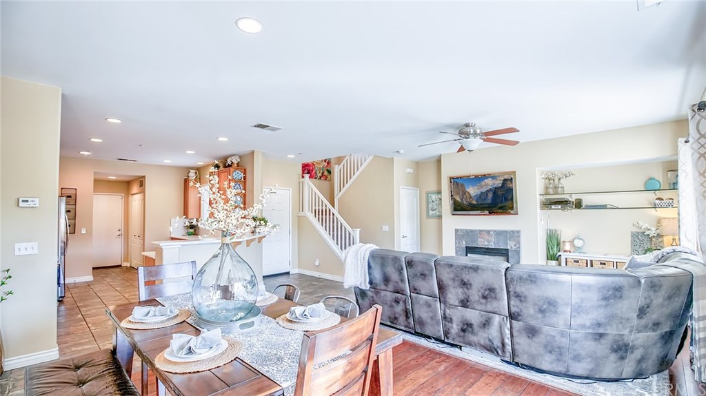 7331 Shelby Place, Unit 23 Rancho Cucamonga, CA 91739 - Photo 12 of 48 a living room with furniture and a wooden floor