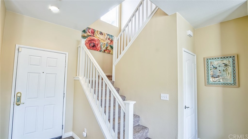 7331 Shelby Place, Unit 23 Rancho Cucamonga, CA 91739 - Photo 14 of 48 a view of an entryway with wooden floor