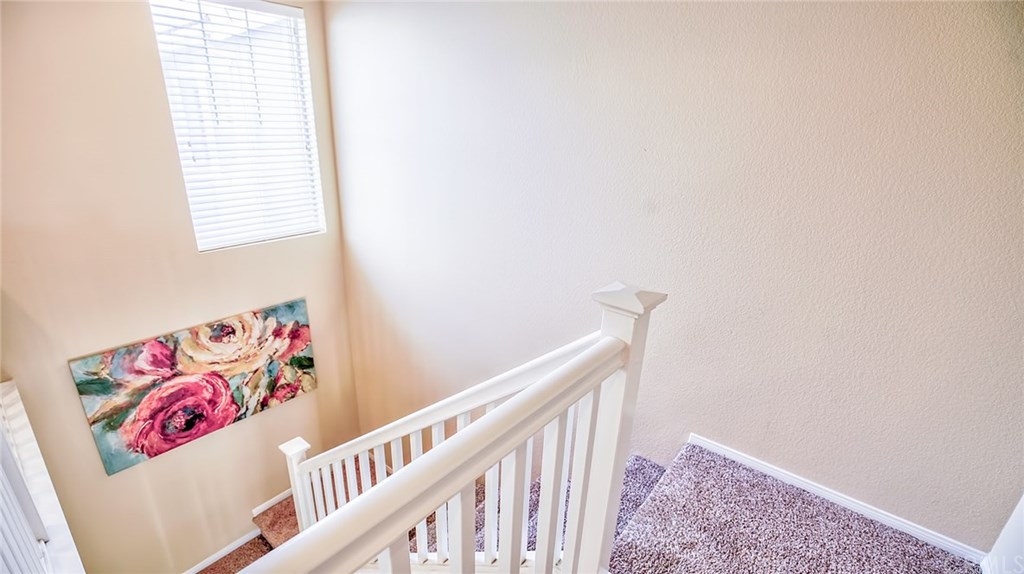 7331 Shelby Place, Unit 23 Rancho Cucamonga, CA 91739 - Photo 15 of 48 a view of entryway with stairs and wooden floor