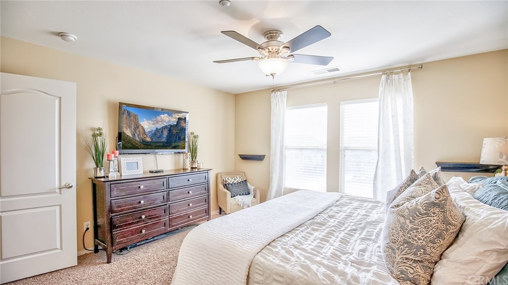 7331 Shelby Place, Unit 23 Rancho Cucamonga, CA 91739 - Photo 18 of 48 a bedroom with a bed and a dresser in it