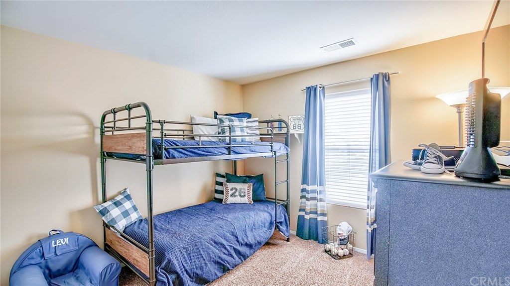 7331 Shelby Place, Unit 23 Rancho Cucamonga, CA 91739 - Photo 20 of 48 a bedroom with furniture and a window
