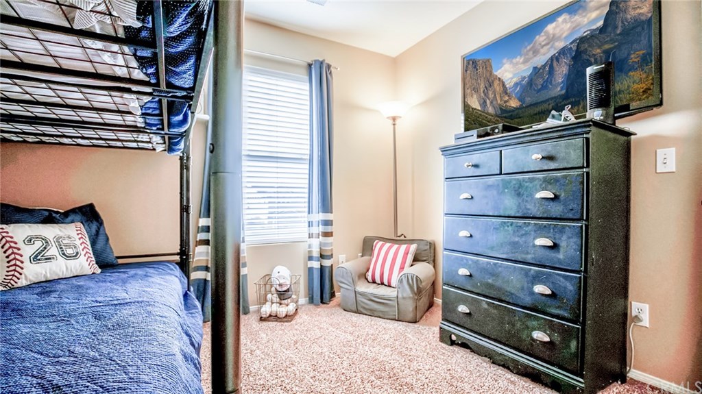7331 Shelby Place, Unit 23 Rancho Cucamonga, CA 91739 - Photo 21 of 48 a bed room with a bed and a television