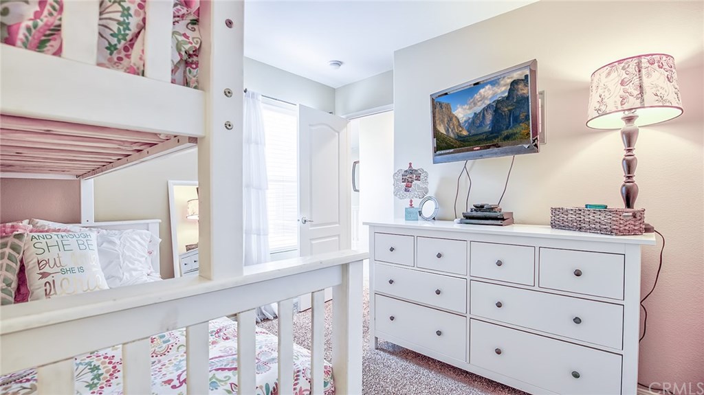 7331 Shelby Place, Unit 23 Rancho Cucamonga, CA 91739 - Photo 22 of 48 a living room with furniture and a flat screen tv