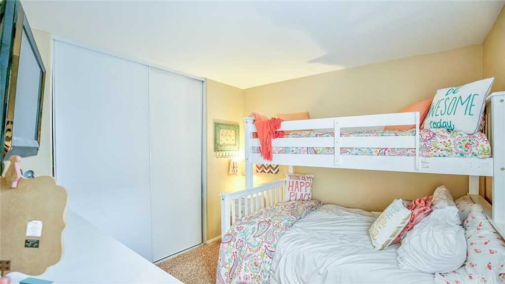 7331 Shelby Place, Unit 23 Rancho Cucamonga, CA 91739 - Photo 23 of 48 a bedroom with a bed and a couch