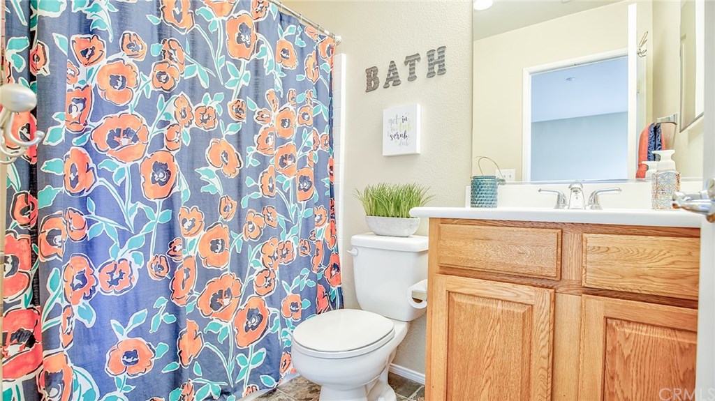 7331 Shelby Place, Unit 23 Rancho Cucamonga, CA 91739 - Photo 24 of 48 a bathroom with a granite countertop sink and a toilet