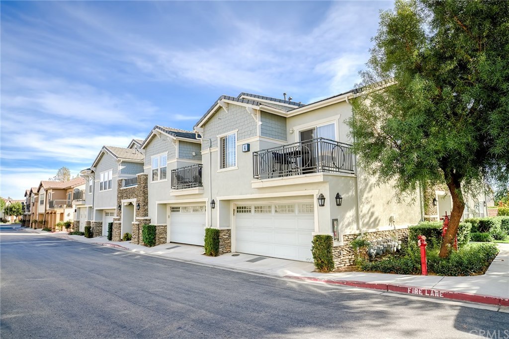7331 Shelby Place, Unit 23 Rancho Cucamonga, CA 91739 - Photo 27 of 48 a front view of a house with a street