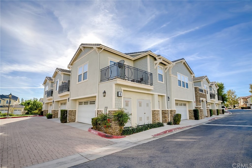 7331 Shelby Place, Unit 23 Rancho Cucamonga, CA 91739 - Photo 29 of 48 a front view of a house with a yard