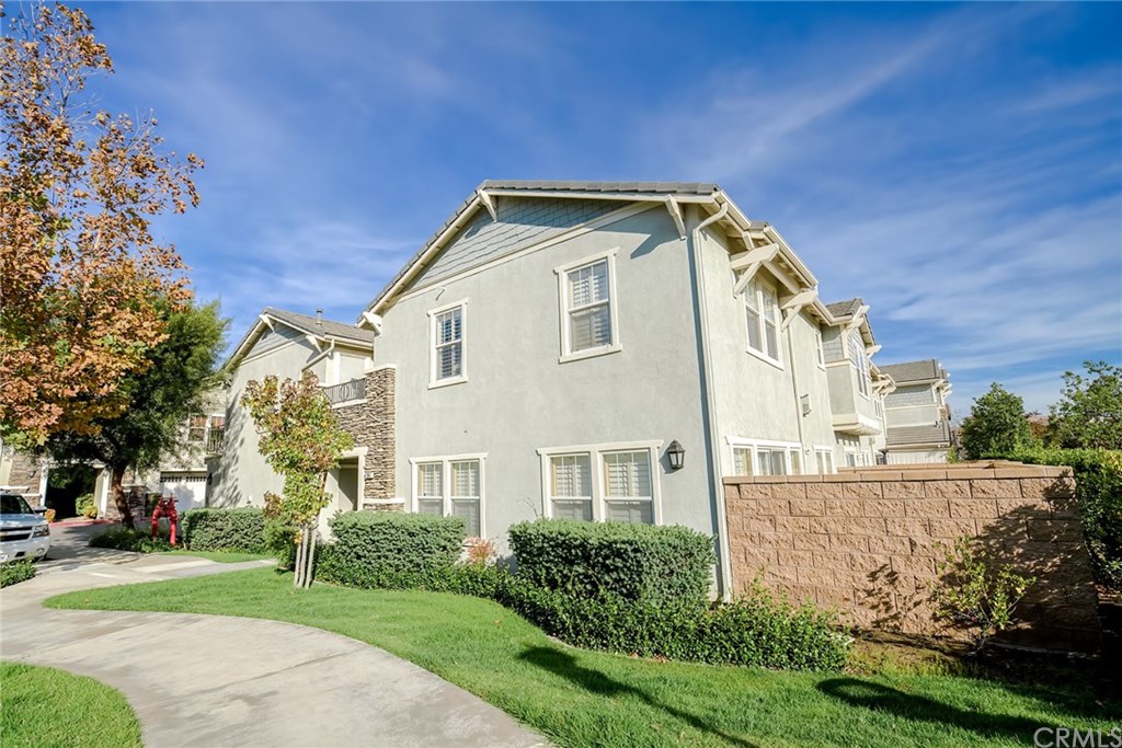 7331 Shelby Place, Unit 23 Rancho Cucamonga, CA 91739 - Photo 30 of 48 a view of a house with a yard