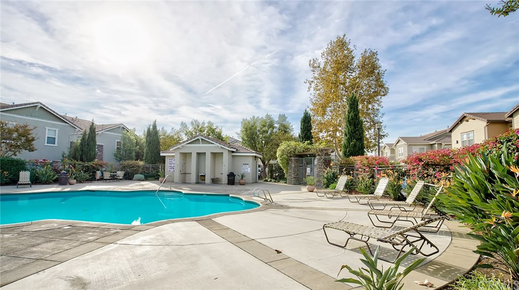 7331 Shelby Place, Unit 23 Rancho Cucamonga, CA 91739 - Photo 37 of 48 a view of a house with a big yard and large trees