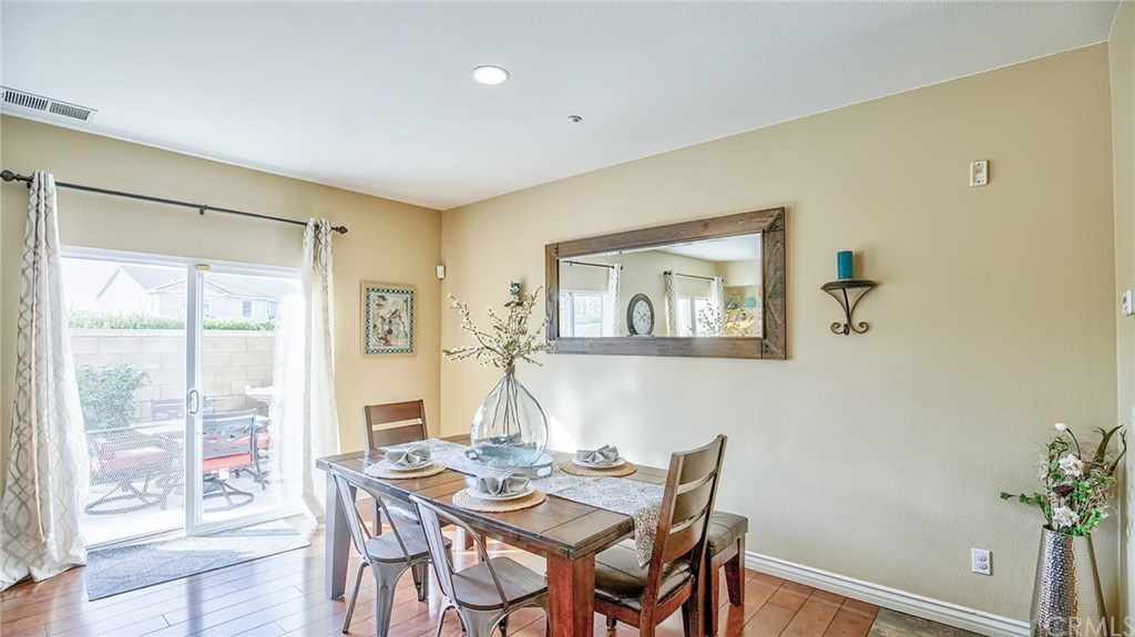 7331 Shelby Place, Unit 23 Rancho Cucamonga, CA 91739 - Photo 9 of 48 a view of a dining room with furniture and a potted plant