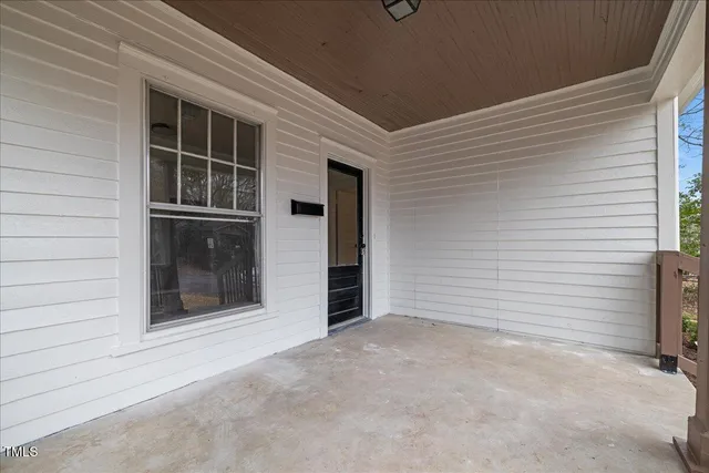 a kitchen with granite countertop a sink and cabinets