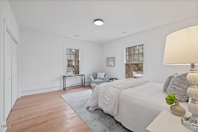 a bedroom with a bed and window