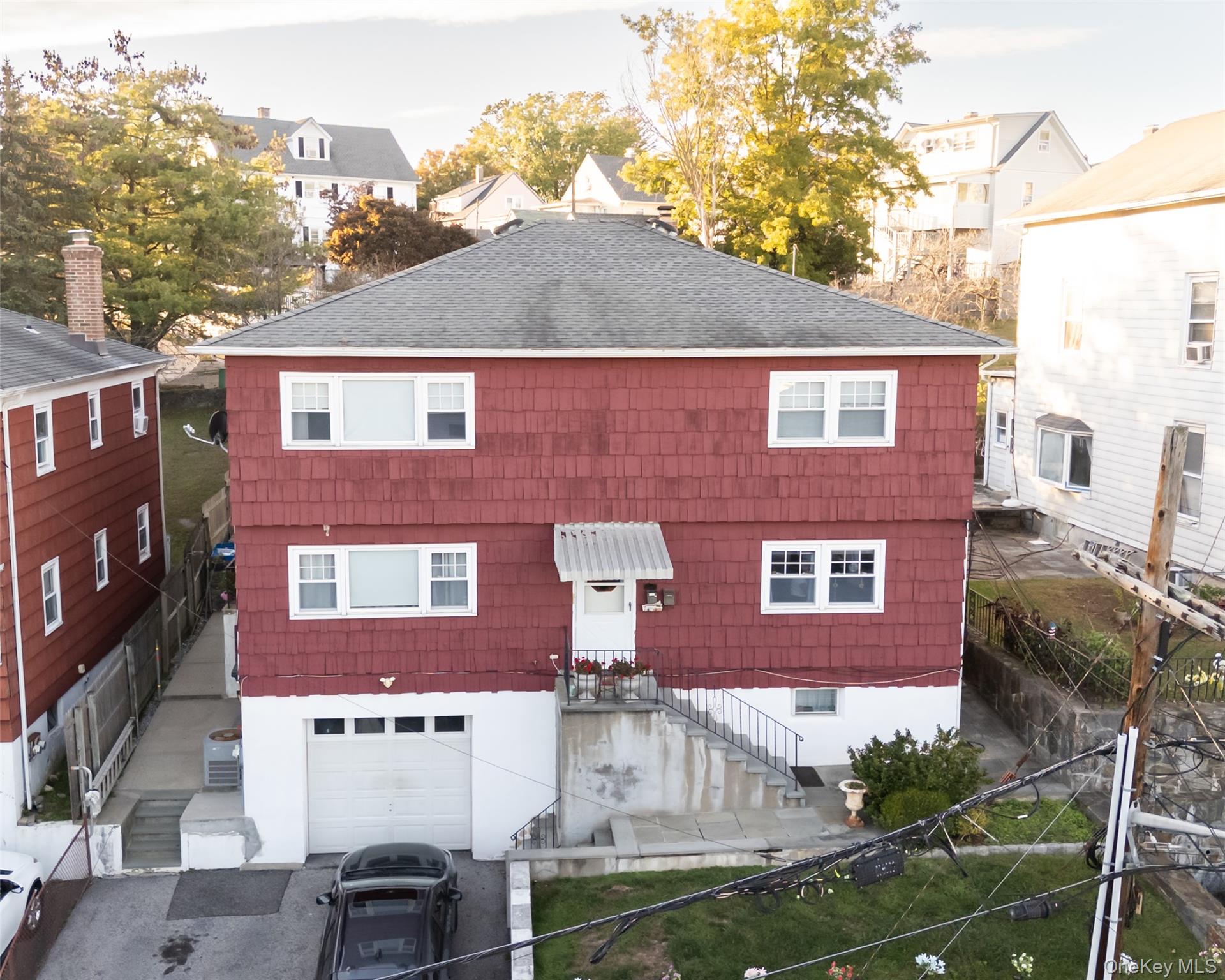 130 Spring Street Port Chester, NY 10573 - Photo 1 of 1 View of front of house featuring roof with shingles and stairway