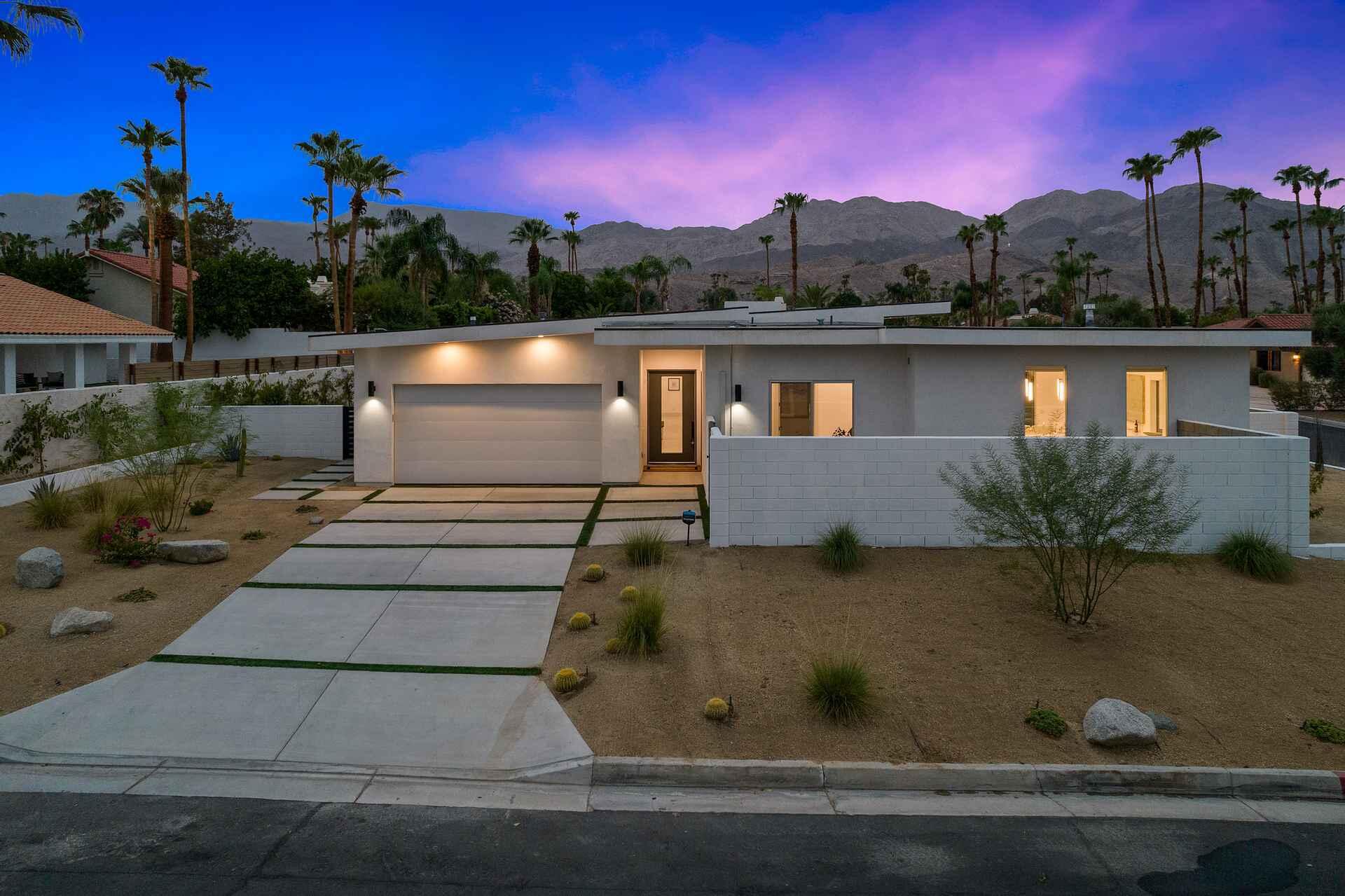 72985 Somera Road Palm Desert, CA 92260 - Photo 16 of 17 a view of a fountain in front of a house