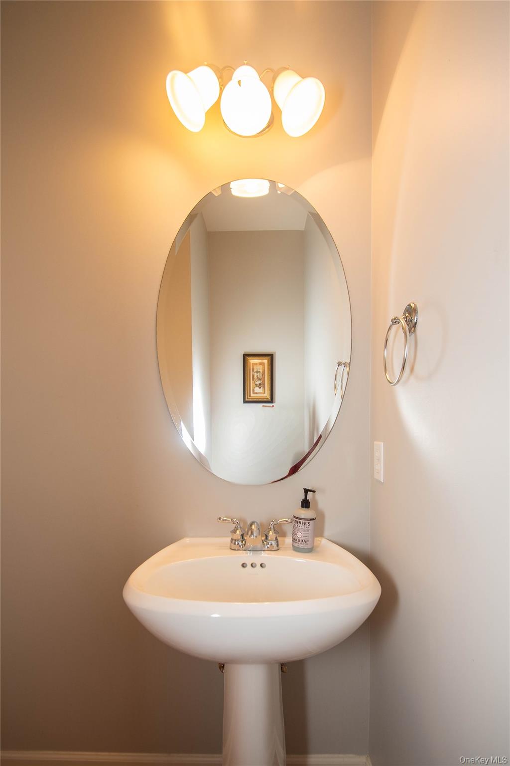 303 Bridgeview Drive Poughkeepsie, NY 12601 - Photo 11 of 25 a bathroom with a sink and a mirror