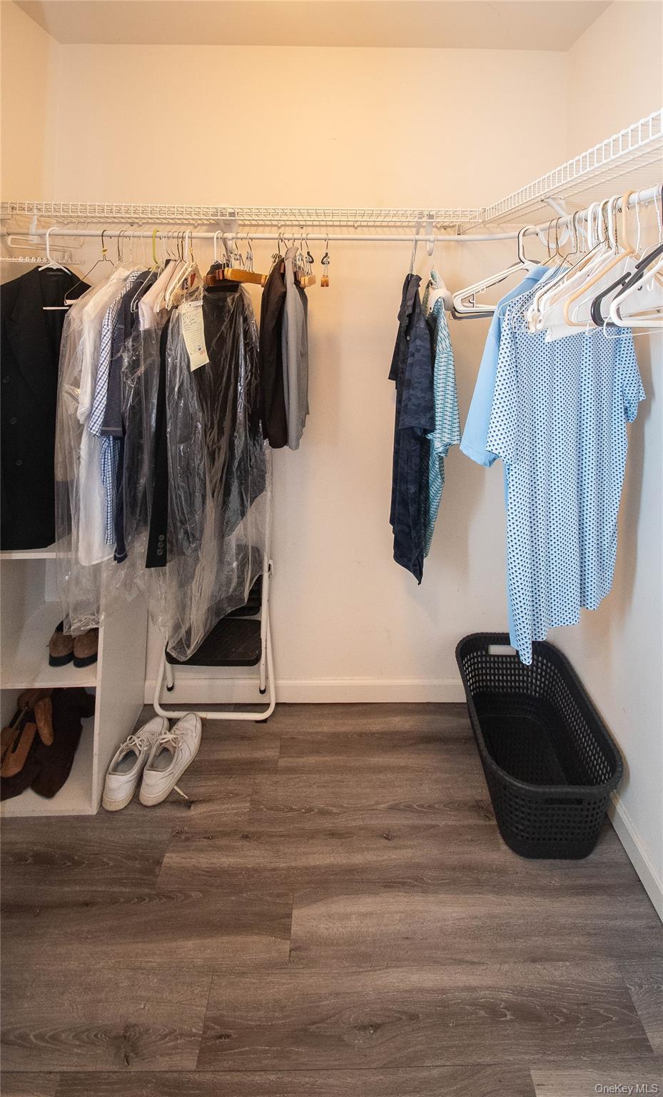 303 Bridgeview Drive Poughkeepsie, NY 12601 - Photo 17 of 25 a walk in closet with wooden floor