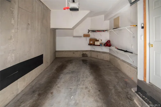 a view of a storage & utility room with two washing machine