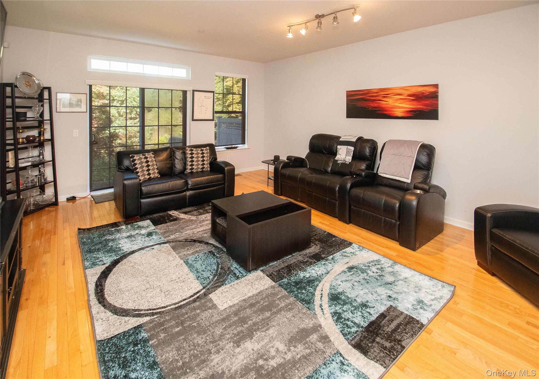 303 Bridgeview Drive Poughkeepsie, NY 12601 - Photo 8 of 25 a living room with furniture and a flat screen tv