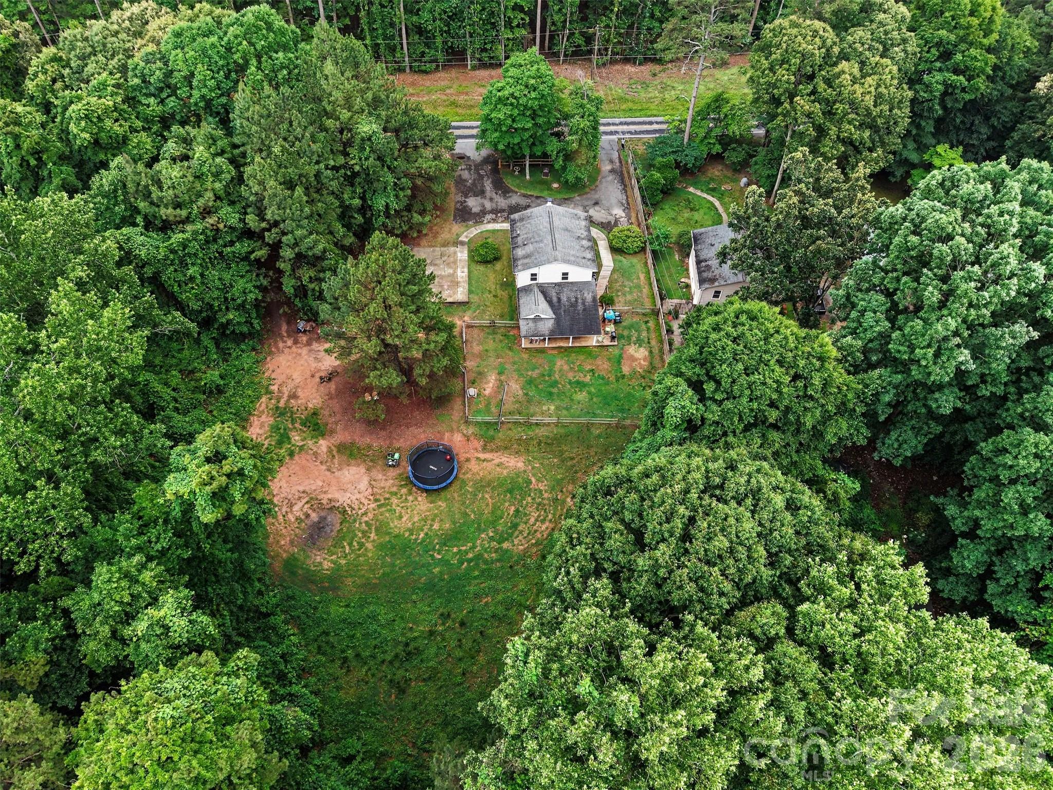 184 Canal Road Belmont, NC 28012 - Photo 14 of 39 an aerial view of residential house with outdoor space and trees all around