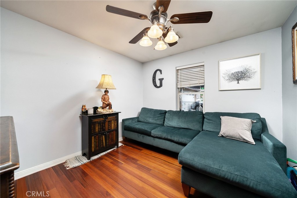 7575 Rancho Road Wrightwood, CA 92397 - Photo 9 of 32 a living room with furniture and a wooden floor