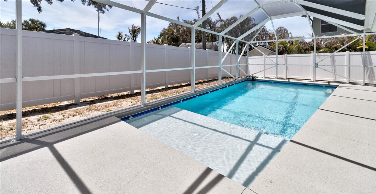 7989 143rd Street Sebastian, FL 32958 - Photo 21 of 30 a view of a backyard with a wooden deck