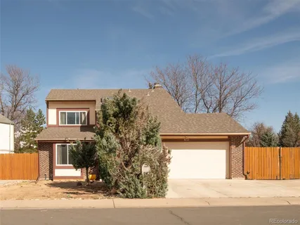 a view of a house with a street