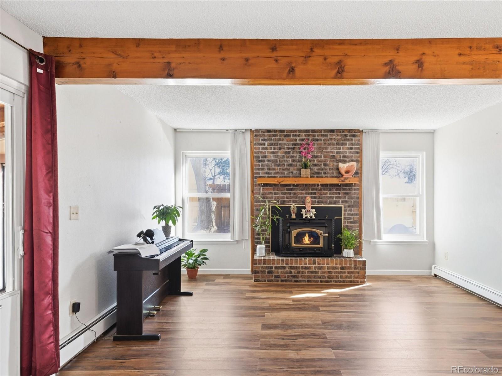 892 South Rifle Way Aurora, CO 80017 - Photo 12 of 32 a living room with furniture and a fireplace