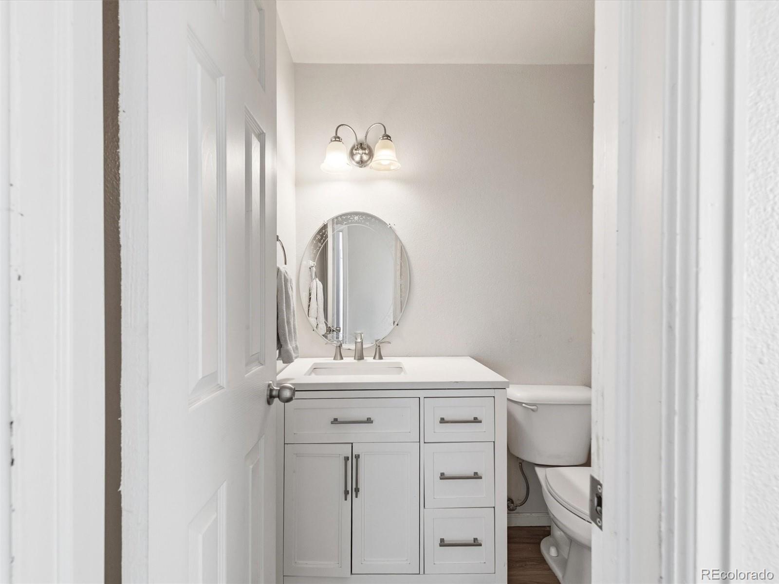 892 South Rifle Way Aurora, CO 80017 - Photo 23 of 32 a bathroom with a sink and a mirror