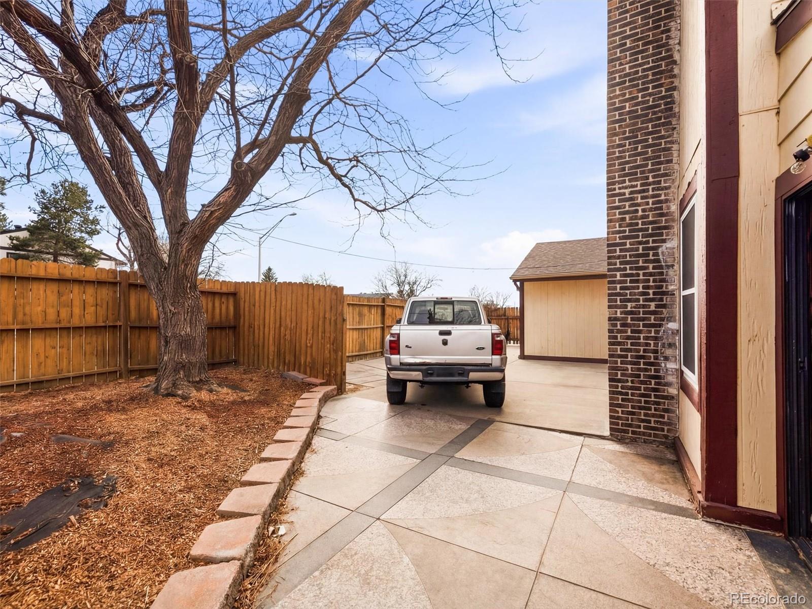 892 South Rifle Way Aurora, CO 80017 - Photo 30 of 32 a view of a house with a yard