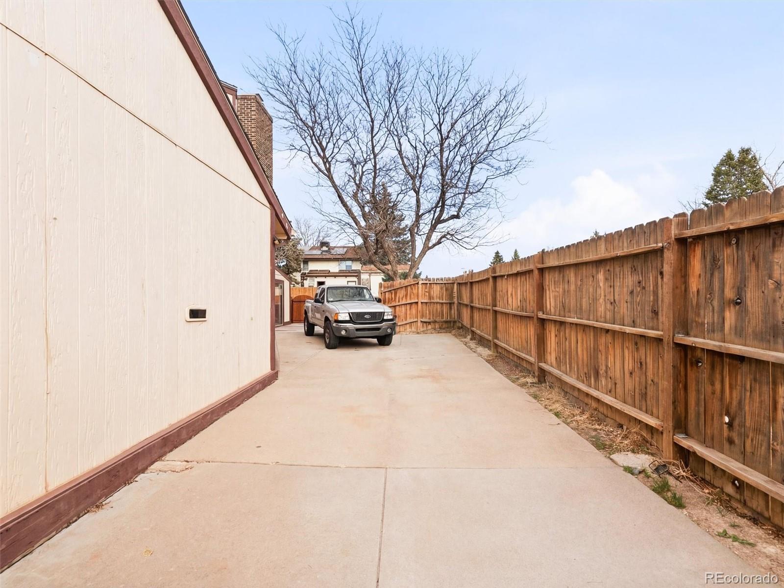 892 South Rifle Way Aurora, CO 80017 - Photo 31 of 32 a view of a truck parked on a road