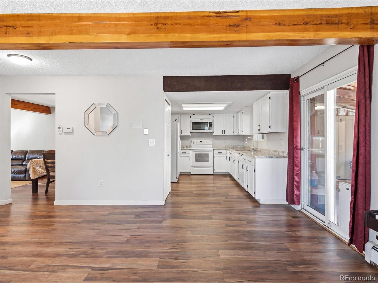 892 South Rifle Way Aurora, CO 80017 - Photo 10 of 32 a view of kitchen with wooden floor