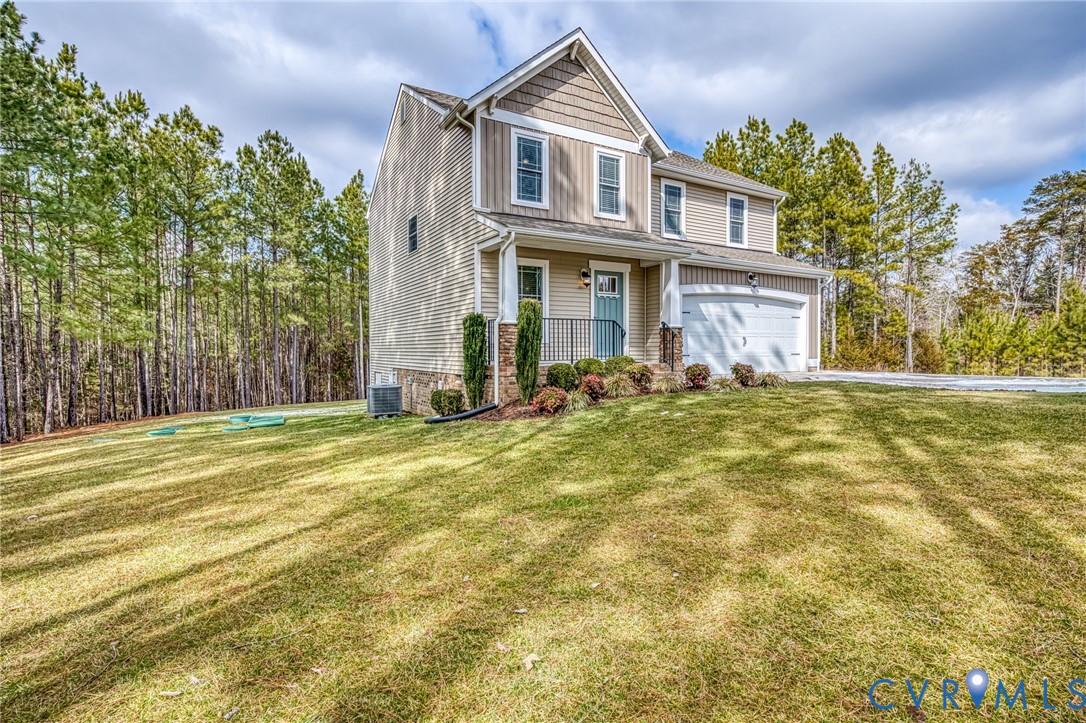 2024 Walnut Tree Place Powhatan, VA 23139 - Photo 2 of 30 a front view of a house with a yard