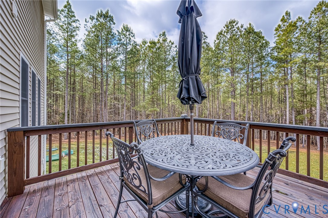2024 Walnut Tree Place Powhatan, VA 23139 - Photo 26 of 30 a view of a balcony with a table and chairs