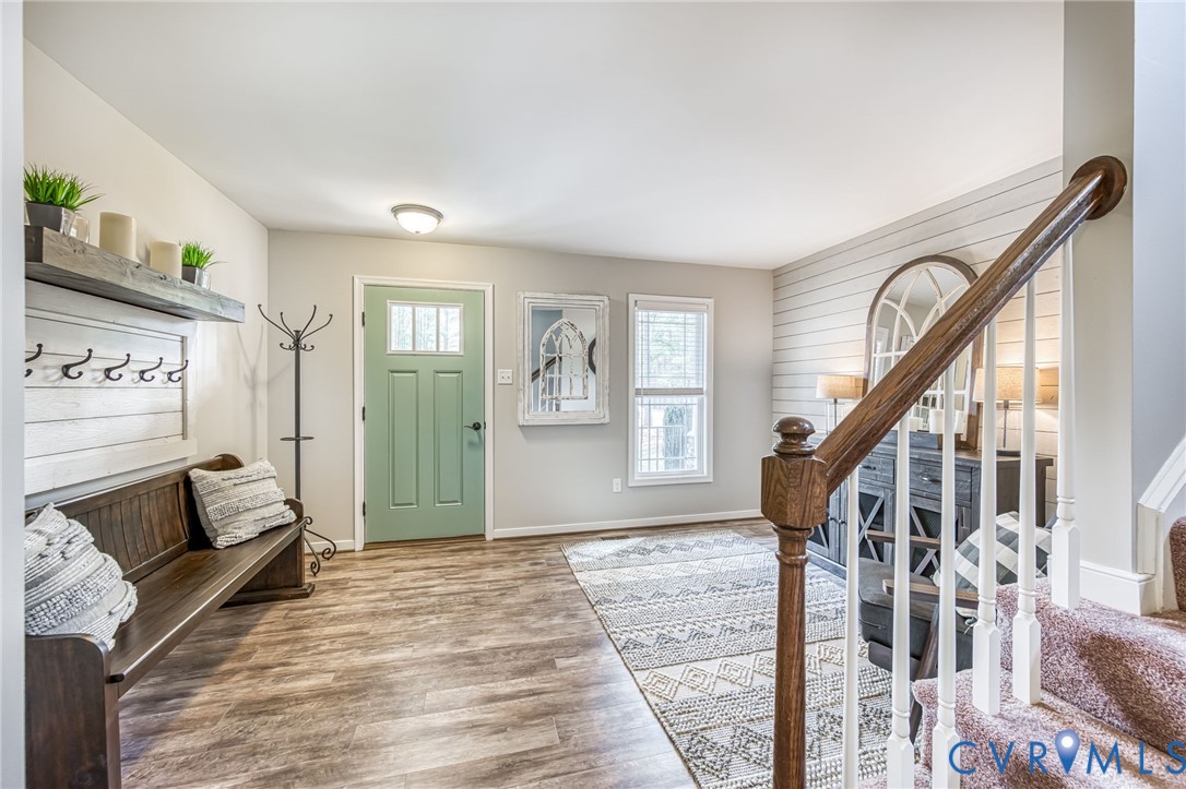 2024 Walnut Tree Place Powhatan, VA 23139 - Photo 5 of 30 a view of an entryway with wooden floor and stairs
