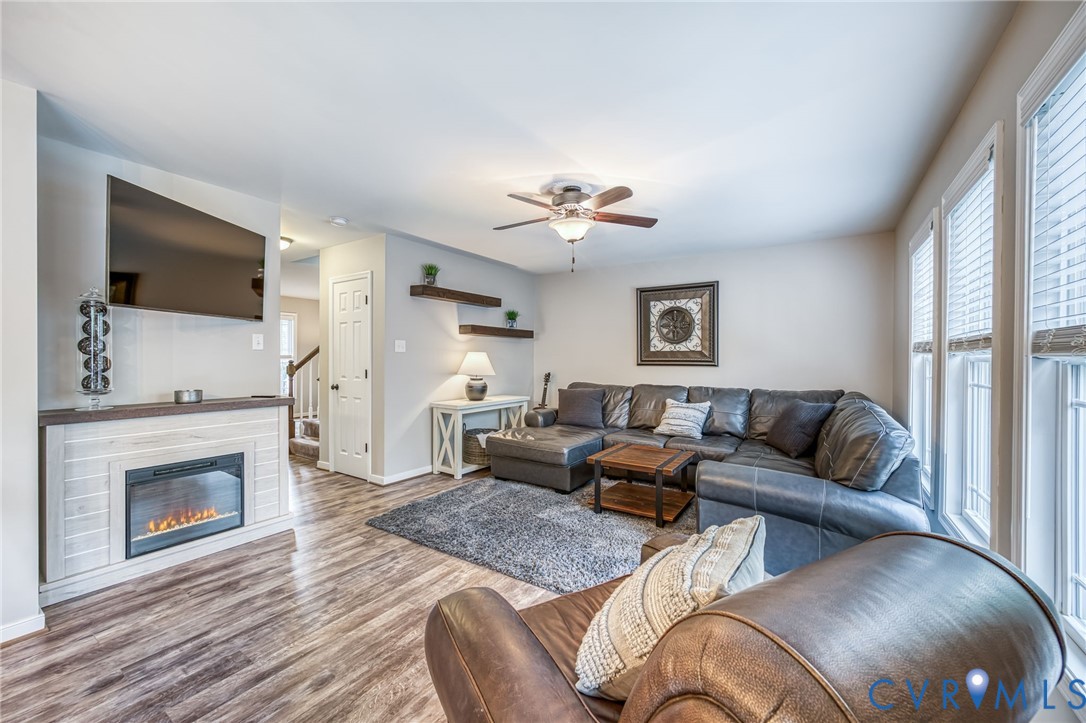 2024 Walnut Tree Place Powhatan, VA 23139 - Photo 7 of 30 a living room with furniture a flat screen tv and a fireplace