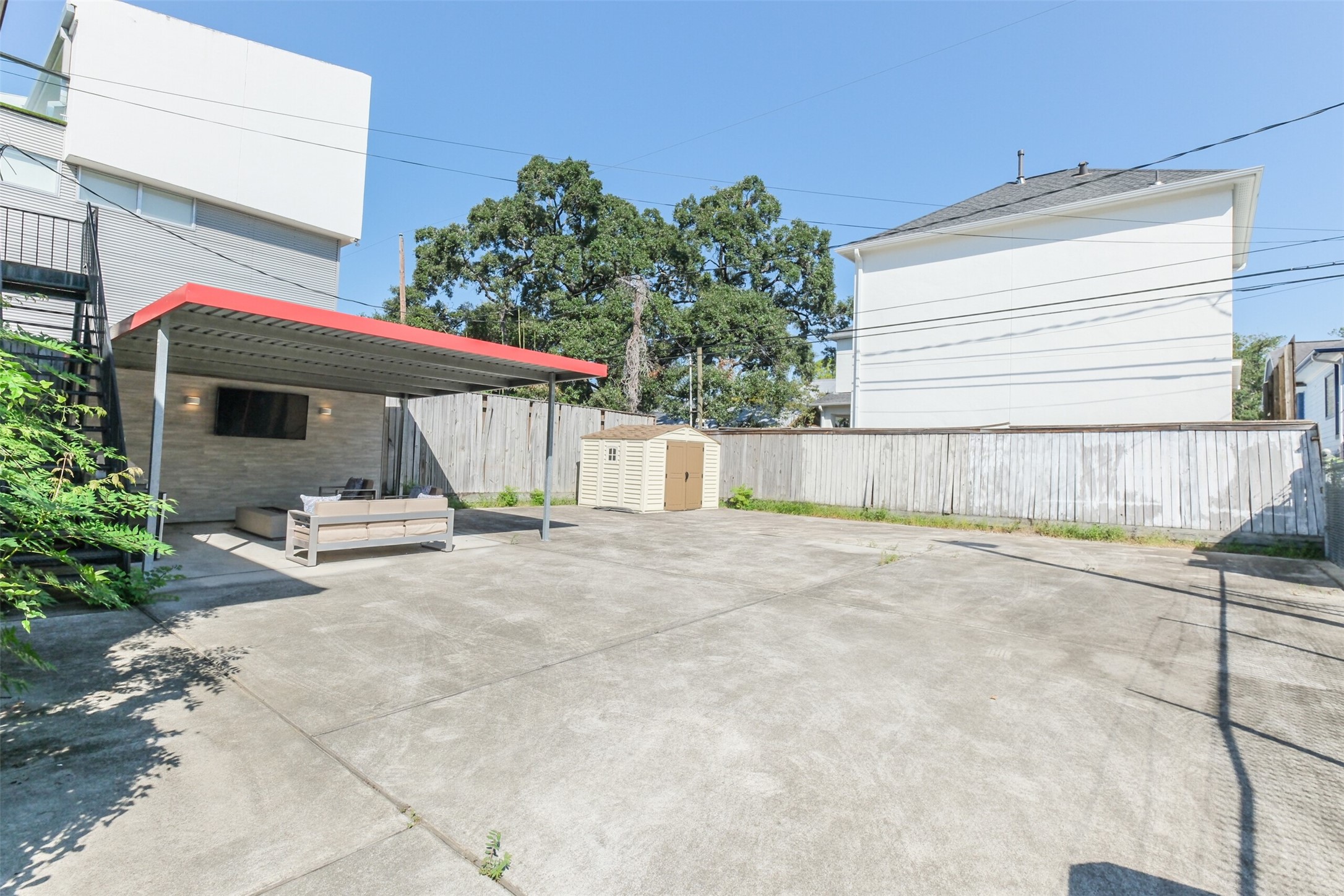 1716 Richmond Avenue, Unit 1 Houston, TX 77098 - Photo 22 of 22 a view of a backyard with sitting area and garage