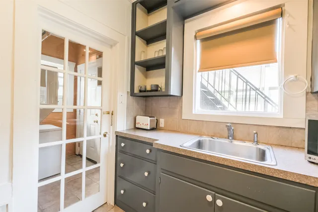 a bathroom with a sink and a window