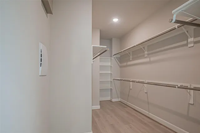 a view of an empty walk in closet
