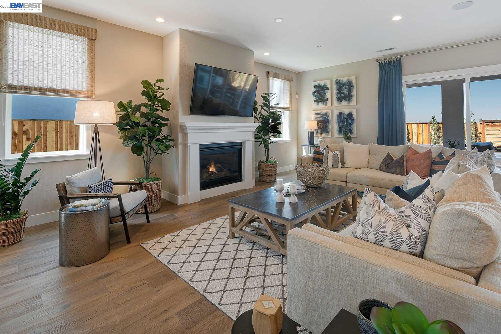 927 Conrad Street Manteca, CA 95336 - Photo 11 of 42 a living room with furniture fireplace and potted plant