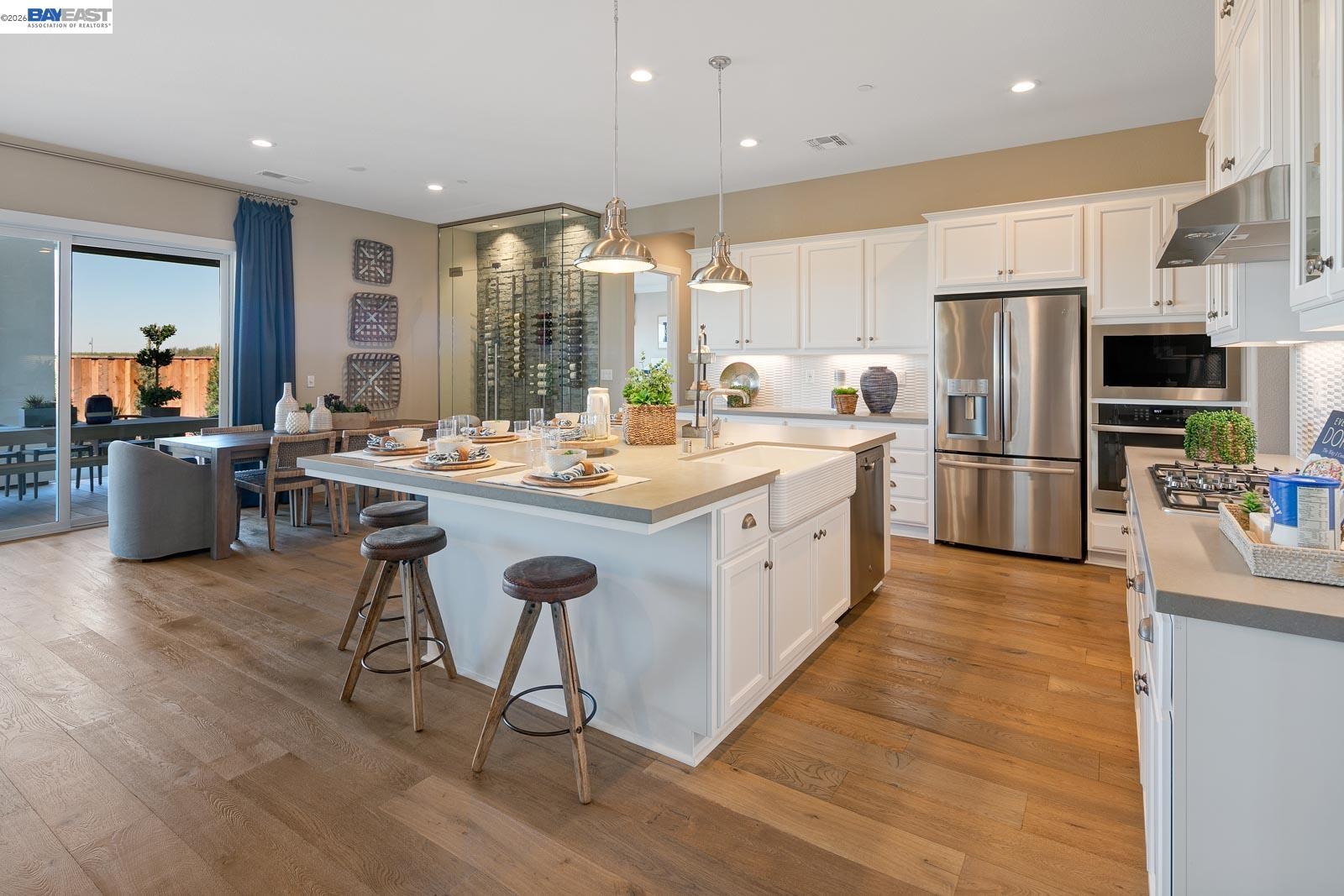 927 Conrad Street Manteca, CA 95336 - Photo 12 of 42 a large kitchen with a large counter top appliances and cabinets